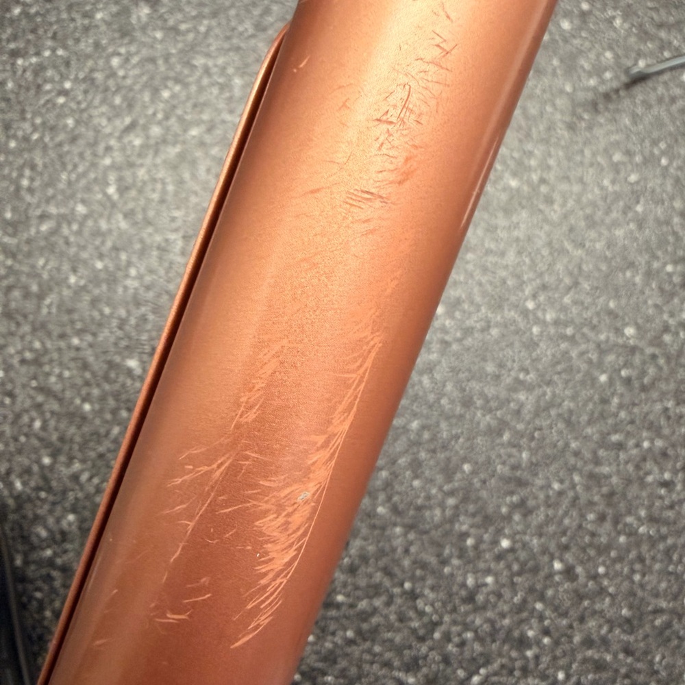 Ceramic curling iron by Chi with light scratches. Barely used!